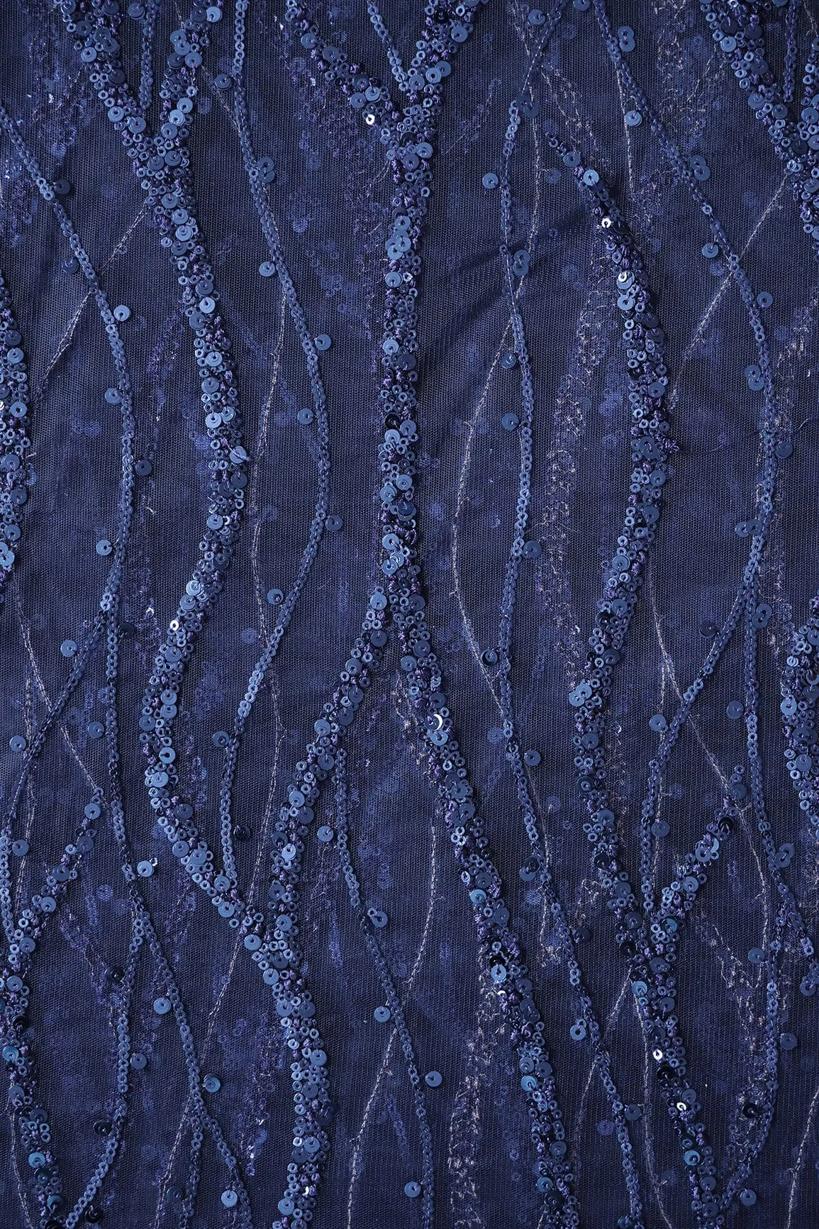 Beautiful Sequins With Blue Thread Wavy Embroidery Work On Navy Blue Soft Net Fabric