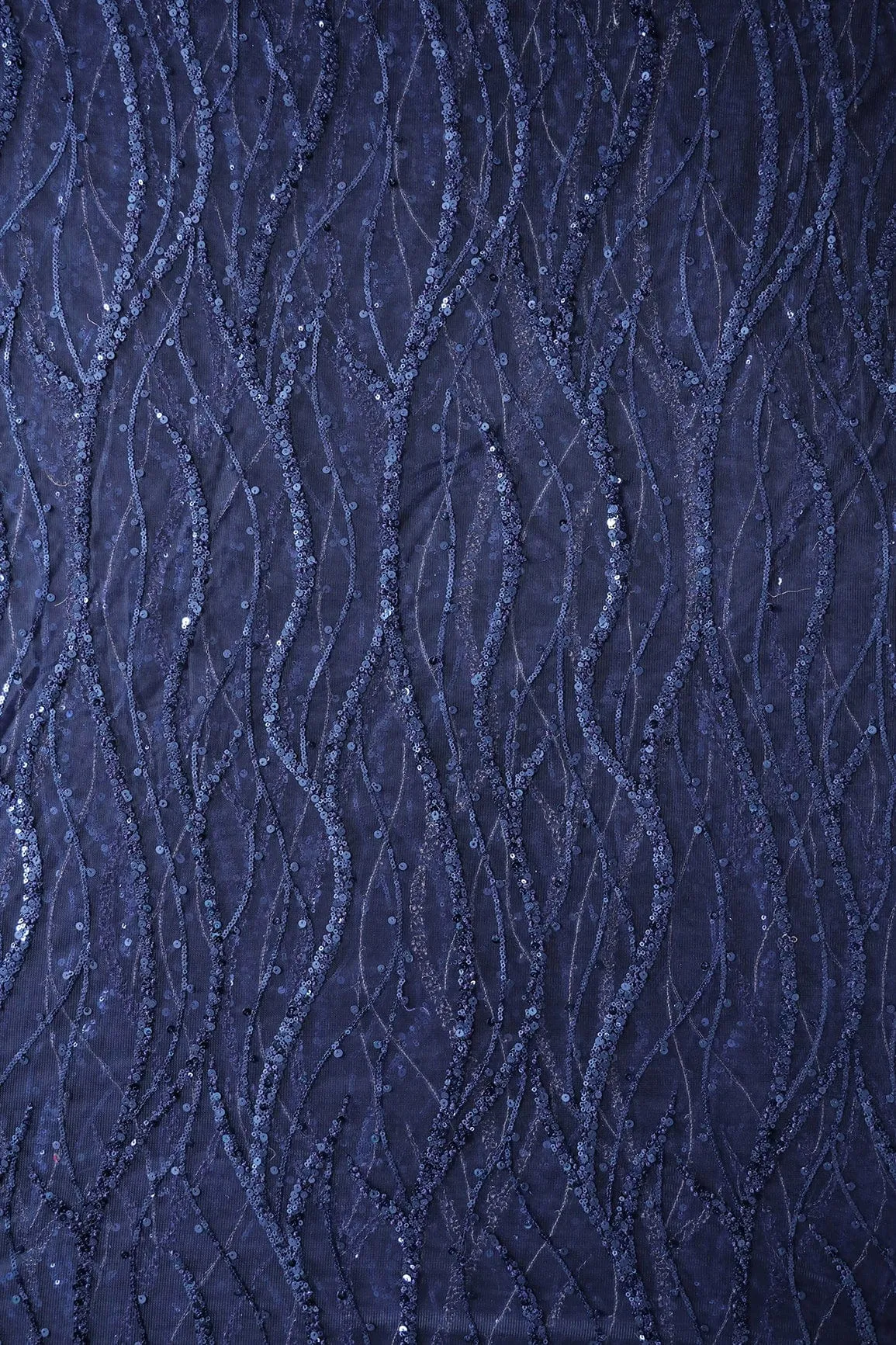 Beautiful Sequins With Blue Thread Wavy Embroidery Work On Navy Blue Soft Net Fabric