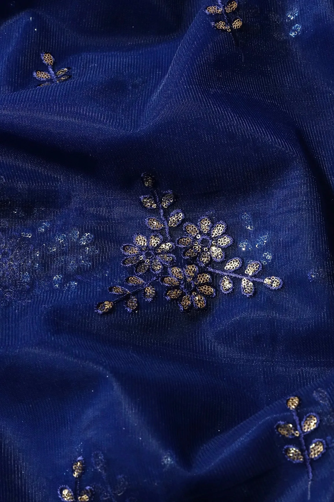 Blue Thread With With Gold Sequins Floral Embroidery Work On Navy Blue Soft Net Fabric