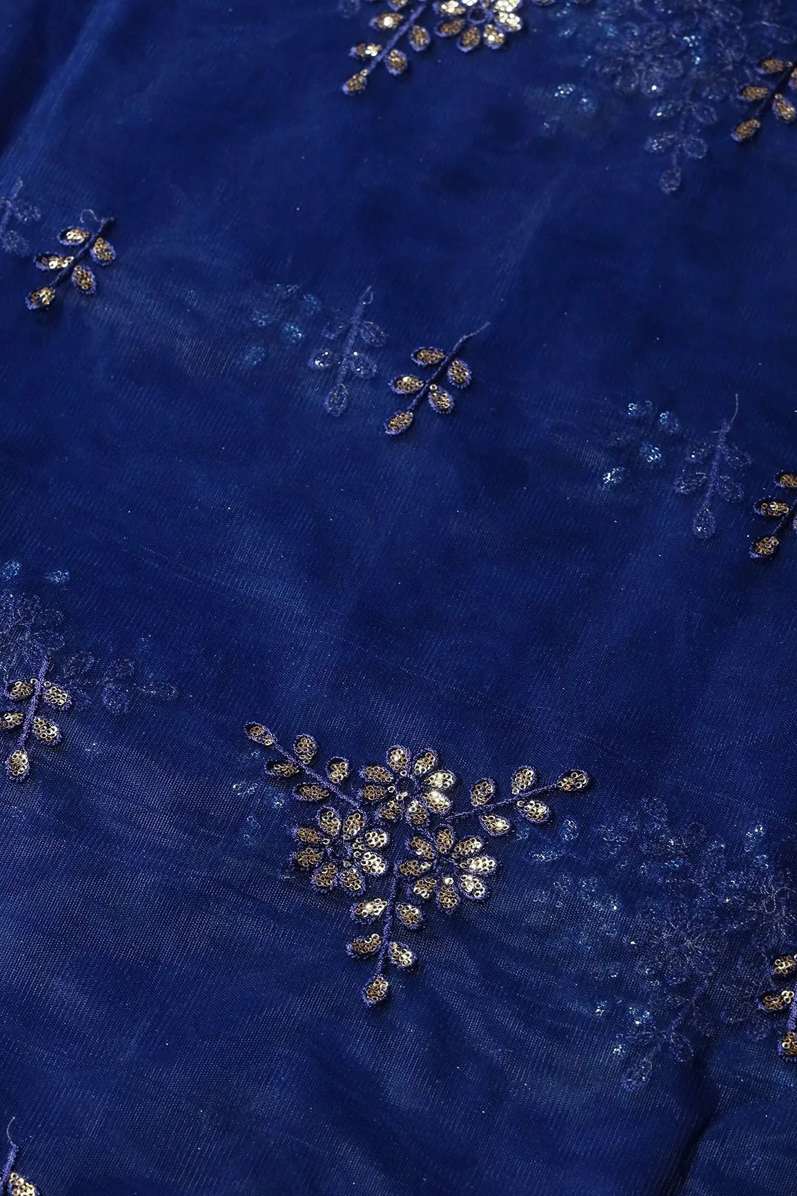 Blue Thread With With Gold Sequins Floral Embroidery Work On Navy Blue Soft Net Fabric